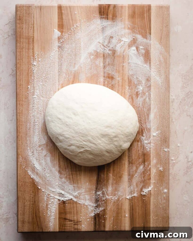 Homemade English Muffin-Style Sandwich Bread Recipe 4 This homemade English muffin bread dough comes together easily and rises before baking.