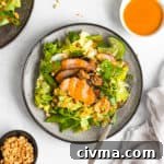 Gochujang pork tenderloin over a salad with gochujang dressing.