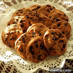 A lace-covered plate holding Oatmeal Chocolate Chip cookies.