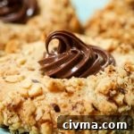 Nutella Filled Hazelnut Thumbprint Cookies